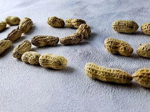 Open peanuts are shot macro in the studio, concept is in the form of the ye.. Stock Photos