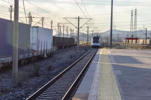 Open perspective shot of suburb train at railway station Stock Photos