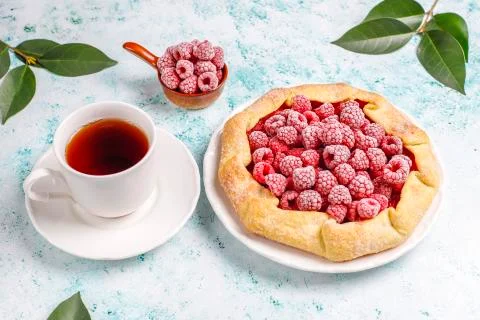 Open pie, raspberry galette. Summer berry dessert. Stock Photos