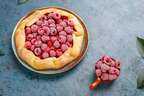 Open pie, raspberry galette. Summer berry dessert. Stock Photos
