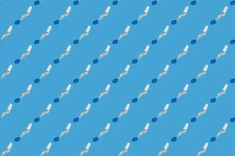 Open pilsl with powder off seamless pattern on blue background. Stock Photos