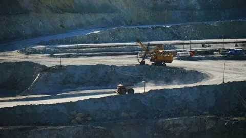 Open pit, large coal mine quarry. Mining dump trucks in the open pit mine Stock Footage 161749087