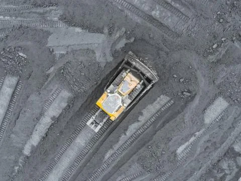 Open pit mine, breed sorting. Mining coal. Bulldozer sorts coal. Extractive 写真素材