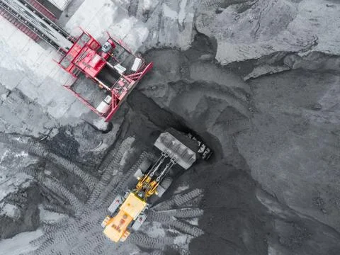 Open pit mine, breed sorting. Mining coal. Bulldozer sorts coal. Extractive 写真素材