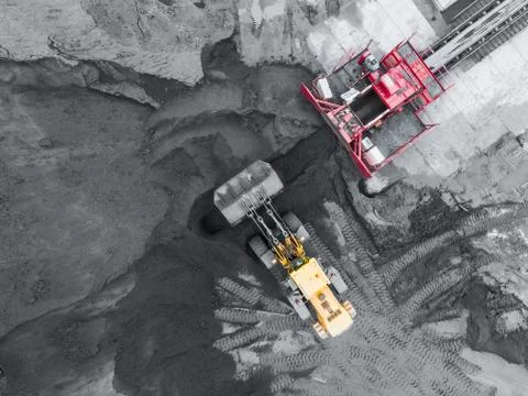 Open pit mine, breed sorting. Mining coal. Bulldozer sorts coal. Extractive Stock Photos