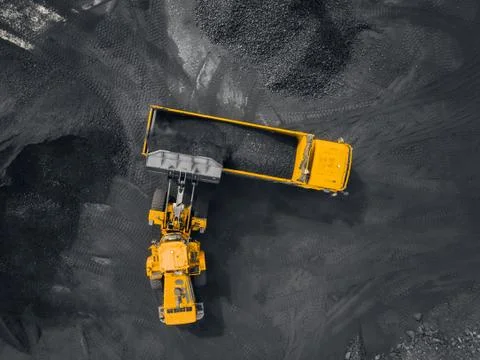 Open pit mine, coal loading in trucks, transportation and logistics, top view Foto stock