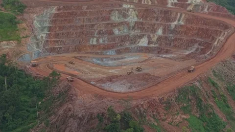 Open pit mine with dump trucks transporting ore Stock Footage 328920677