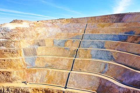 Open pit mine in full operation, with mremediated soils. Stock Photos