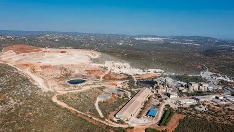 Open pit mine showcasing heavy industry operations with machinery, coal Stock Photos
