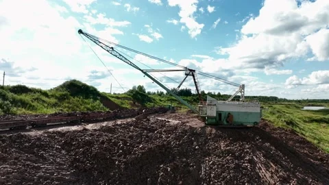 Open-pit mining. Dragline excavator load clay in freight train. Stock Footage 203839470