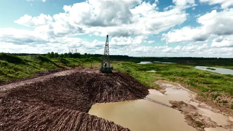 Open-pit mining. Dragline excavator load clay in freight train. Stockbeeldmateriaal 203847994