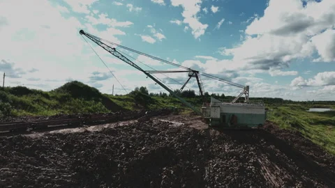 Open-pit mining. Dragline excavator load clay in freight train. 動画素材 203854151