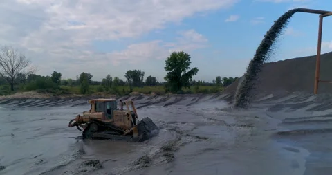 Open Pit Mining. Gold. Washed Rock Discharges to River Bank. Pollution. Dirty Video stock 164642073