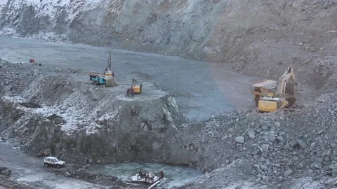Open-pit mining. A huge mining truck and excavator do their job in a quarry. Stock Footage 122212667