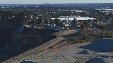 Open-pit mining quarry with heavy machinery operating Stock Footage 340123077