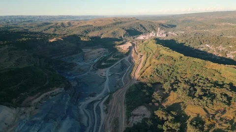 Open pit quarry and extraction valley with haul roads aerial mining landscape Stock Footage 335387504