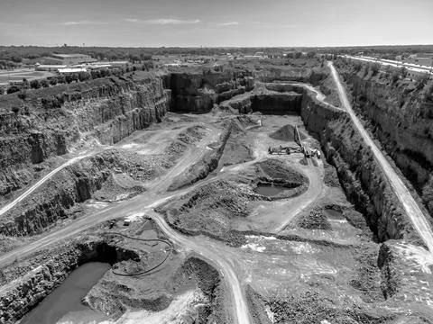 Open pit view of a quartzite rock quarry in Sioux Falls, South Dakota Stock Photos