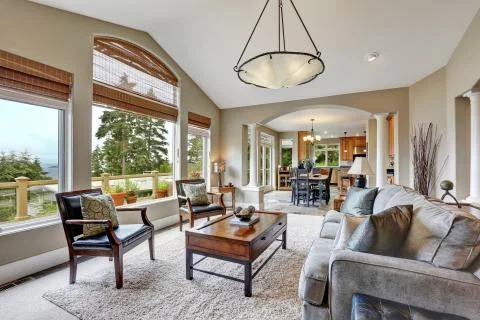 Open plan living room interior in luxurious house  with kitchen room in the b Stock Photos