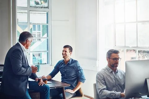 An open plan office is perfect for the collaborative team. colleagues having a Stock Photos
