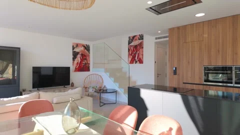Open-plan villa kitchen with modern furnishings and natural light interior Stock Footage 324453283