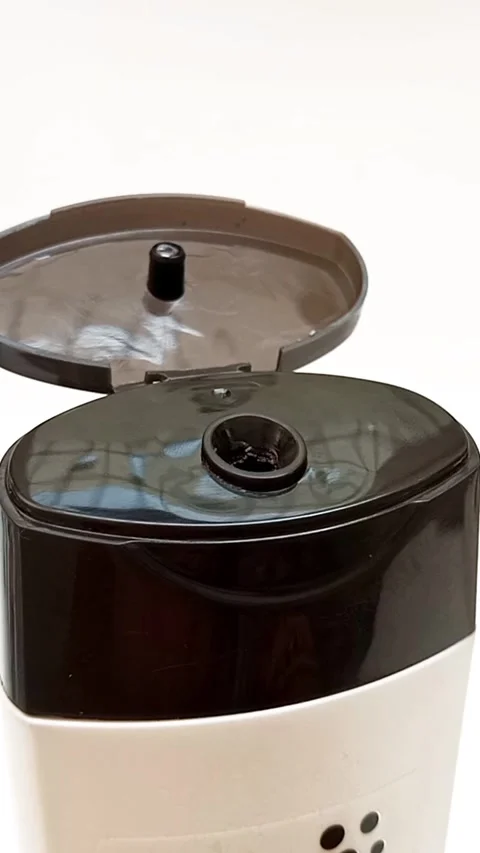 An open plastic bottle cap rotating on a white background, black color open cap Stock Footage 306515196