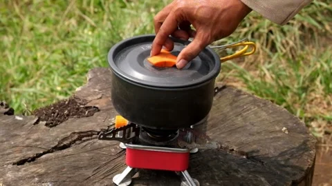 Open a portable pot with boiling water Stock Footage 291530364