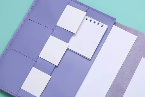 Open purple folder with note pads and sticky notes inside Stock Photos
