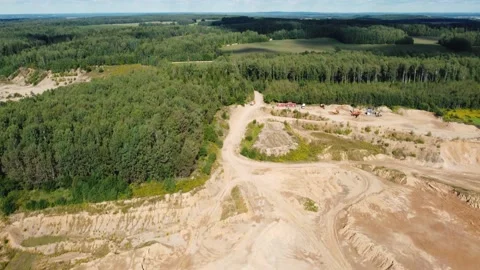Open quarry for industrial sand mining with wheel loader and dump trucks Stock Footage 163375060