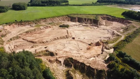 Open quarry for industrial sand mining with wheel loader and dump trucks Stock Footage 163375237