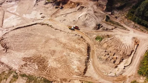 Open quarry for industrial sand mining with wheel loader and dump trucks Stock Footage 163375869