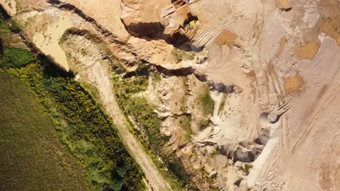 Open quarry for industrial sand mining with wheel loader and dump trucks Stock Footage 163375890