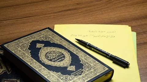 Open Quran and Write Arabic Stock Photos