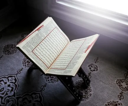 Open quran in front of windows 写真素材