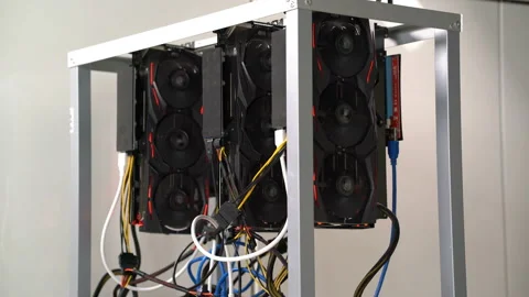 Open rack for cryptocurrency mining includes graphics cards, motherboard and Stock Footage 86911537