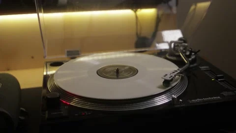 Open record player turntable playing white vinyl Stock Footage 157081079