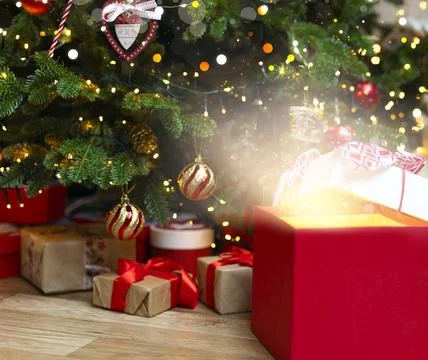 Open red box with bright glow, highlights and blurred lights. Stock Photos