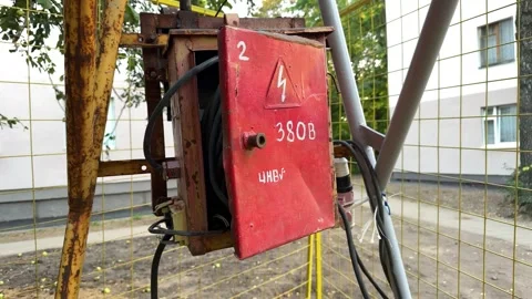 Open red electrical box with high voltage warning and cables  Video stock 347515110