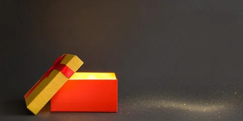 Open red gift box with a bow with a golden glow and glitter inside on a bla.. Stock Photos