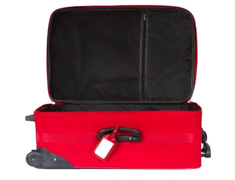 Open red suitcase with blank identification tag over white. Stock Photos