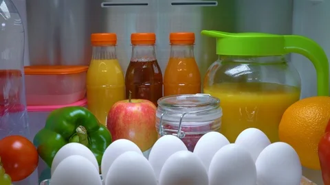 Open refrigerator filled with food. Healthy food. Stock Footage