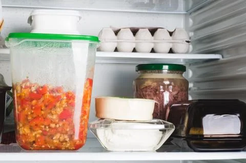 Open refrigerator full of different products. Food supply for a week. Stock Photos