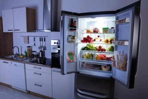 Open Refrigerator In Modern Kitchen Fotos de archivo