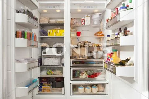 Open Refrigerator With Stocked Food Products Stock Photos