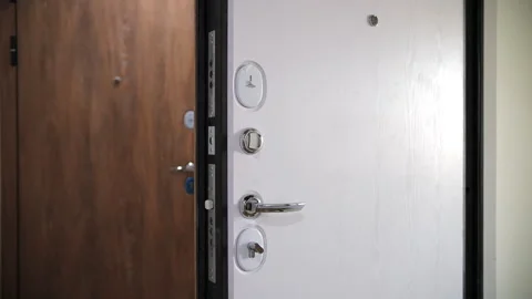 Open reinforced door with multiple locks Stock Footage 300336352