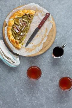 Open rhubarb pie on the table. Stock-Fotos