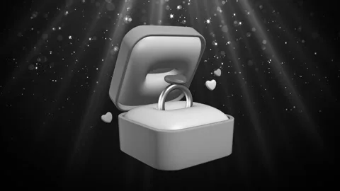 Open ring box with silver ring and floating hearts Loop Stock Footage 308224405