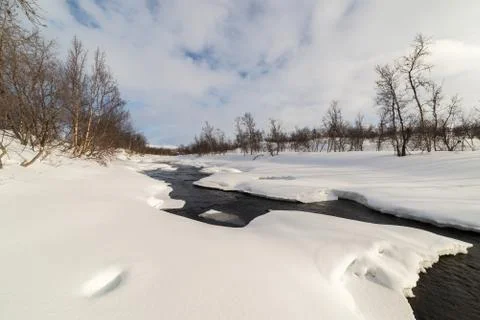Open river snow on riverside at mountain Norway Stock Photos