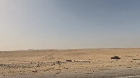 Open road experience across Cairo Fayoum Desert Road endless desert horizons Video stock 329847534