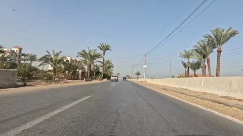 Open road experience through Cairo Fayoum Desert Road endless desert scenery Stock Footage 329842418