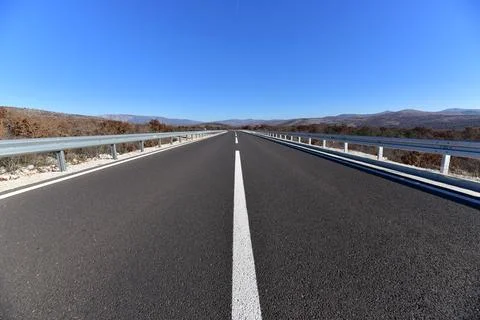 The open road. Highway. New asphalted road. Stock Photos
